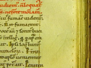 Example of pricking which was used to rule lines in manuscripts.